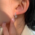 Minimalist silver star stud earrings with pave-set cubic zirconia on ear for women - Star Ear Pin-Silver