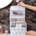 Hanging travel toiletry bag with green cactus pattern and multiple organizer compartments - Cactus