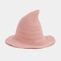 Detailed close-up of pink knitted witch hat showing fine crochet texture and wavy brim - Pink