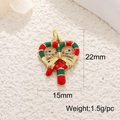 Macro detail of Christmas heart pendant in gold plated copper with enamel and crystals - Bowknot Candy Cane