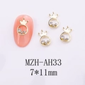 Close-up of golden alloy crown nail art charm with white rhinestones, size 7x11mm - Crown Style (AH33)