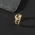 Detailed macro shot of a gold enamel evil eye ring with moon and star zircon details - N-Moon Star Twin Evil Eye