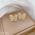 Macro shot of gold butterfly earrings with white rhinestones on beige satin background - Gold Butterfly Stud Earrings (A111)