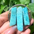 Handheld gold circular hair clip featuring raw turquoise natural crystals wired securely - Gold Circle Amazonite Slice