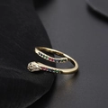 Macro detail of a golden snake ring featuring colorful zircons and intricate eye carving - Multi-Color Zircon Snake Style B1