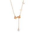 Rose gold butterfly necklace with pearl tassel and stainless steel charms on white background - Rose Gold