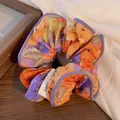 Floral print scrunchie in orange and purple tones with premium satin finish - Orange Purple Floral