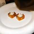 Close-up of vintage amber resin hoop earrings with 14K gold plating on a white tray - C-Type Vintage Earrings (74#) / Amber Gold Plated
