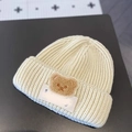 Cozy cream-colored knitted beanie for toddlers featuring a cute 3D bear patch design - LUCK Bear Rice White