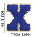 Detail of blue towel embroidered letter X patch with gold sequins and 8cm size markings - Letter X