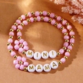 Detailed view of pink beaded MAMA and MINI bracelet set with golden flower accents - Pink Gold MINI/MAMA Two-piece Scene Style