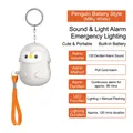 Portable penguin safety alarm in cream white with 130dB sound and LED flashlight keychain - Chinese Packaging / Penguin / Cream White