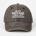 Detail of grey washed denim baseball cap with funny white printed text and fabric texture - Coffee
