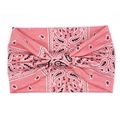 Detail of pink bohemian paisley headband with a central twist knot on white backdrop - Pink Paisley