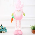 Pink Easter gnome plush with rabbit ears holding a carrot and long striped legs - Pink Standing Telescopic Doll