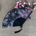 Classic black folding fan with butterfly and pink floral print on linen background - No.55 Black Butterfly Pink Flower
