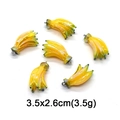 Detail of yellow banana fruit charms with size 3.5x2.6cm and weight 3.5g for DIY jewelry - Iridescent Banana Bunch