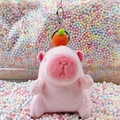 Pink Capybara plush keychain with orange fruit detail on macaron foam background - Pink Orange Style + Silver Clip
