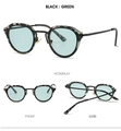 Detail view of oval retro sunglasses with black-grey frame and light green lenses - Black Frame Green Lens