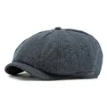 Classic newsboy cap in dark blue and grey knit texture with a small metal logo detail - One Size / Navy Blue