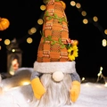 Fall harvest gnome with orange plaid hat and sunflower detail on dark bokeh background - Autumn Harvest Doll Style B (Beard)