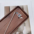 Detail of silver ethnic hair pin with colorful enamel charms on a dark wooden tray - F0742 Hair Stick-24# (Three Color Pendant Ethnic)