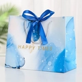 Blue marble texture gift bag with satin bow and silver rope handles for events - Blue Bubble