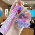 Purple sea flower keychain with starfish liquid shaker and Happy Moments silicone strap - Purple