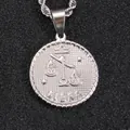 Silver Libra zodiac coin pendant necklace with embossed scales and textured finish - Libra / Steel