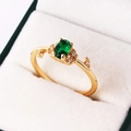 Macro detail of oval emerald zircon ring with leaf diamond accents in a jewelry box - One Size (Adjustable Open) / Oval Green Stone with Leaf Accent (JZ353-2)