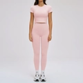 Women's pale pink two-piece yoga set with slim fit short sleeve crop top and leggings - S / Short Sleeve + Pants — Ceramic Pink