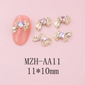 Dettaglio di ciondoli per unghie a fiocco 11x10mm con strass a cuore viola brillante - Base Oro Rosa Stellato (AA11)