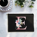 Black canvas cosmetic bag with floral letter E print and durable metal zipper - Letter E