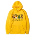 Bright yellow Christmas hoodie with Merry Goosmas cartoon duck print in a flat lay view - Yellow