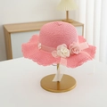 Detail of pink straw sun hat showing wavy brim, fabric flowers and delicate ribbon - Hat / Watermelon red