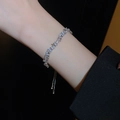 Detailed view of silver butterfly bracelet with pearls and crystals on a dark background - Platinum-Plated Pearl Zirconia Splicing Bracelet