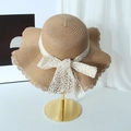 Straw sun hat with white lace bow and wavy brim on golden stand for women - Khaki (D-217)