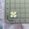 Macro shot of resin flower charm on measurement board showing 1.4cm diameter size - White Four-Petal Flower Small