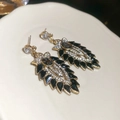Detail of vintage style gold earrings with black leaves and crystal diamond accents - Gold & Black Flower Leaf (925 Sterling Silver Earring Post)