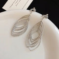 Elegant silver-toned layered oval dangle earrings with textured metal finish jewelry - Clip-on Earrings / Silver