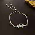 Close-up of adjustable silver tennis bracelet with zircon butterfly and slide clasp - Butterfly Design / Silver