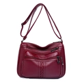 Women's burgundy faux leather crossbody bag with multiple zippers and woven details - Style 1 / Burgundy