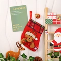 Close-up of a red felt Christmas stocking with a plush bear and plaid details - Checkered Sock - Bear