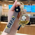 Porte-clés panda sable mouvant avec paillettes étoiles dorées et sangle ours gris - Sucette