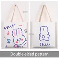 White canvas tote bag with blue cartoon rabbit design and 23cm handle for students - Tulip Blue Rabbit (With Pocket & Zipper)