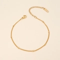 Detail van 18K vergulde roestvrijstalen ketting met gouden kralen en karabijnsluiting - Sterrenhemel Ketting Armband