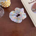 Pink and blue plaid checkered scrunchie hair tie on a wooden table with aesthetic props - Colorful Blue