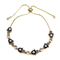 Adjustable golden Hamsa hand bracelet with evil eye charms and sparkling crystals - Black