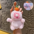 Pink plush capybara keychain with orange fruit accessory and metal ring closure - Squeak Pink Capybara