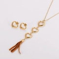 Dettagli del set gioielli cuore dorato con strass trasparenti e nappa in pelle marrone - Oro